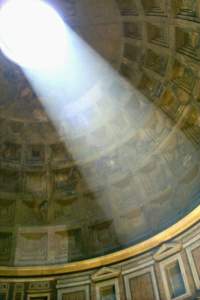 The sun shining through the perfectly circular hole cut in the dome