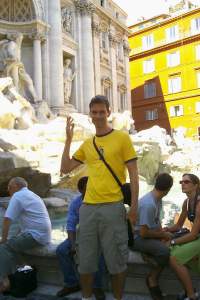 Tossing a coin into the Trevi Fountain
