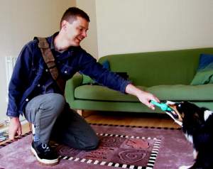 Neil playing with Kirstie's dog, whose name I (obviously) forget.