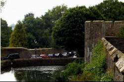 The walls of the garden around the Bishop's Palace, and beneath
it, the moat. The moat is filled from an adjcaent natural spring (which gave Wells its name). In
a gap between the two trees at the very left of the pic, you can barely make out a distant hill
with a tower on it - that's Glastonbury Tor, some five miles away: more on that later.