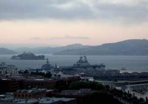 Their late afternoon view from my balcony, with an aircraft carrier docked
near Fisherman's Wharf, for Fleet Week
