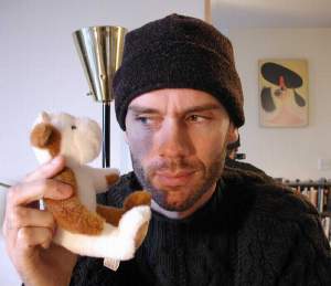 Wrapped up, and sick; but at least I have a cuddly toy.