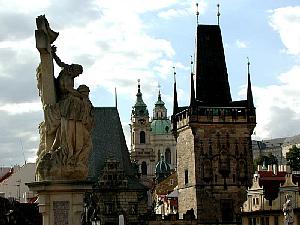 On the other side of Charles Bridge, a view of spires and statues