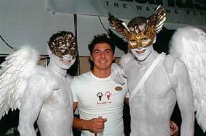 At the White Party on the cruise ship, with an off-duty crew member. His girlfriend asked him to pose with us for the photo.
